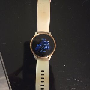 Smartwatch with Gold Bezel and Cream Band